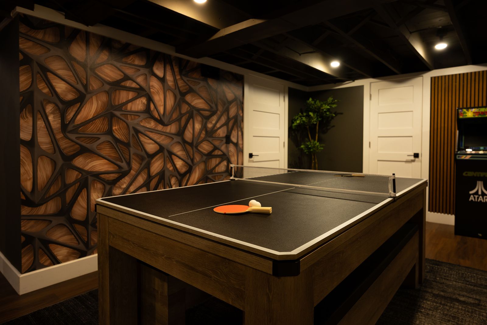 Ping pong table beside the copper mural