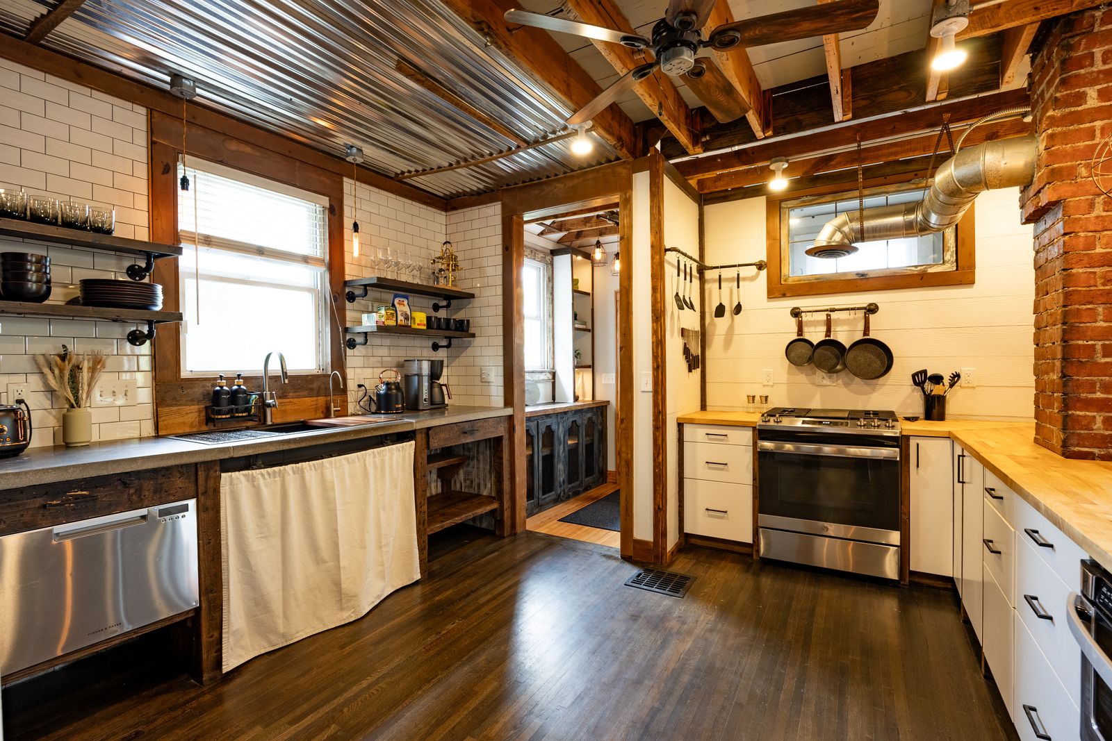 Kitchen with gas range and open shelving
