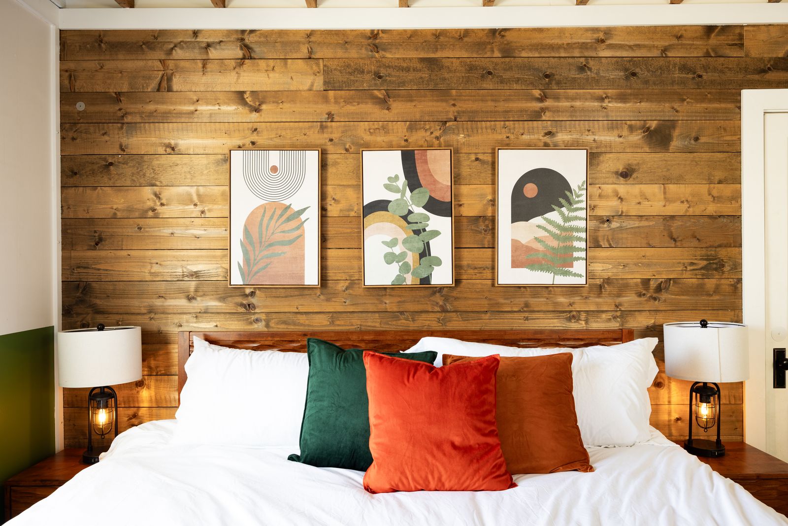 King primary bedroom with wood accent wall