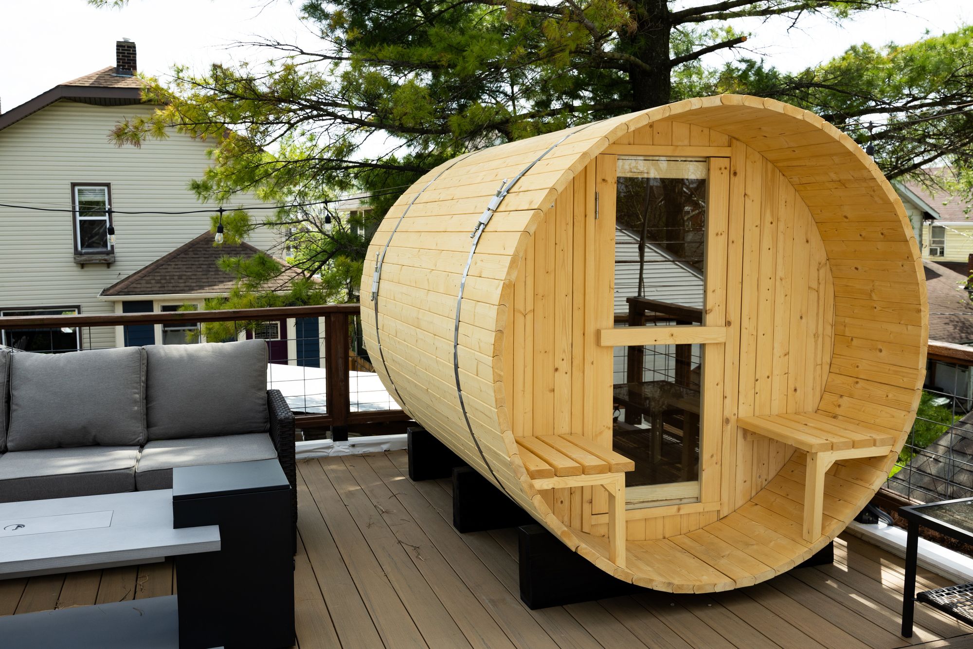 Barrel sauna and sectional on the rooftop deck