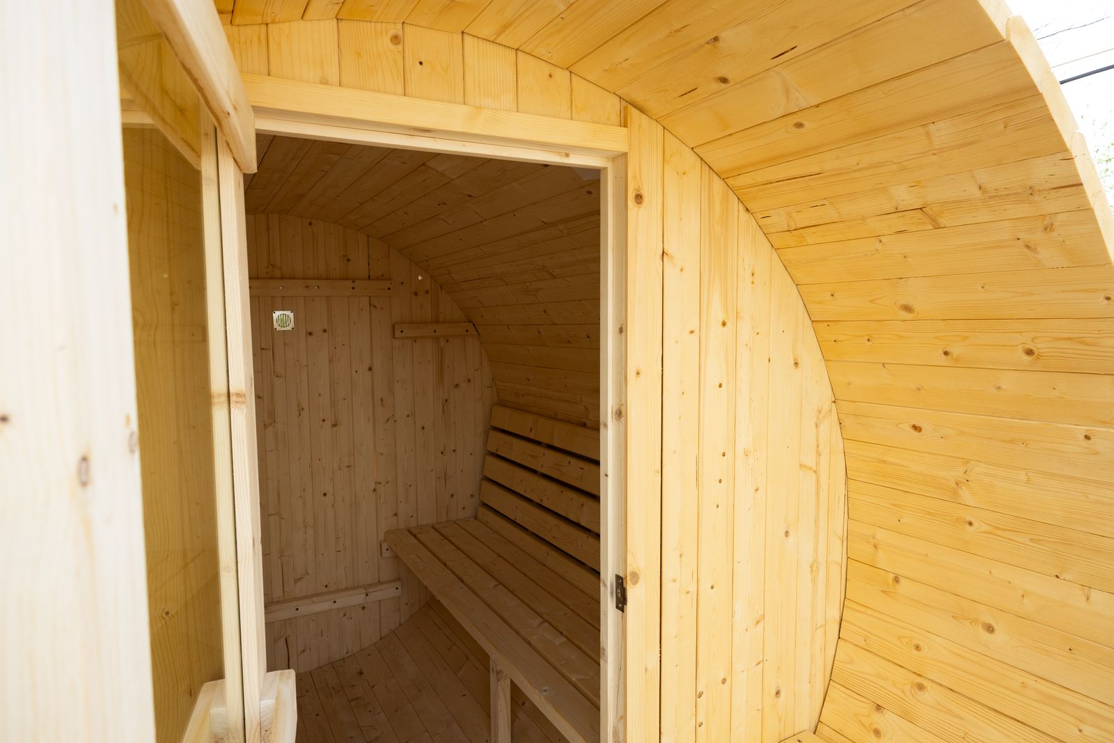 Inside the pine barrel sauna
